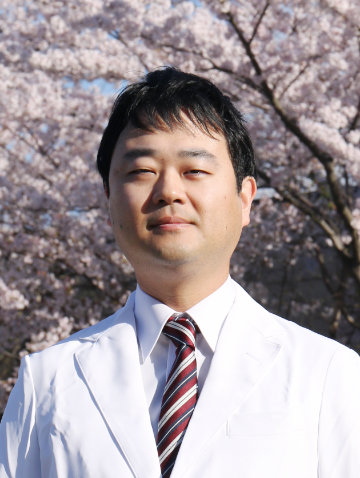 本間 健一